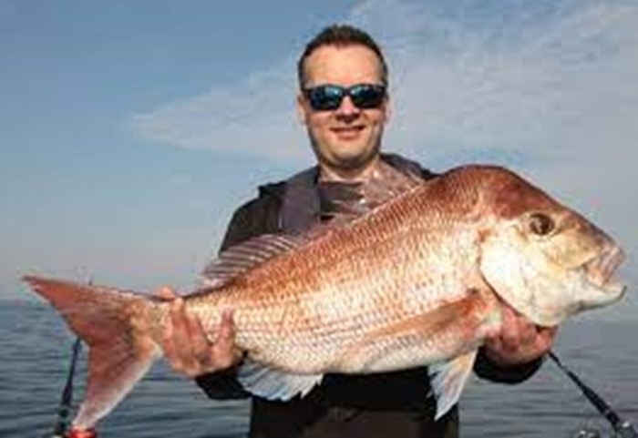 Man holding large fish